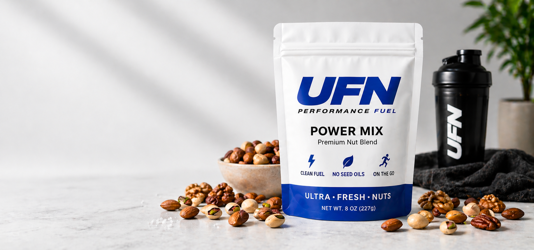 UFN Performance Fuel package with nuts and a shaker bottle on a light background
